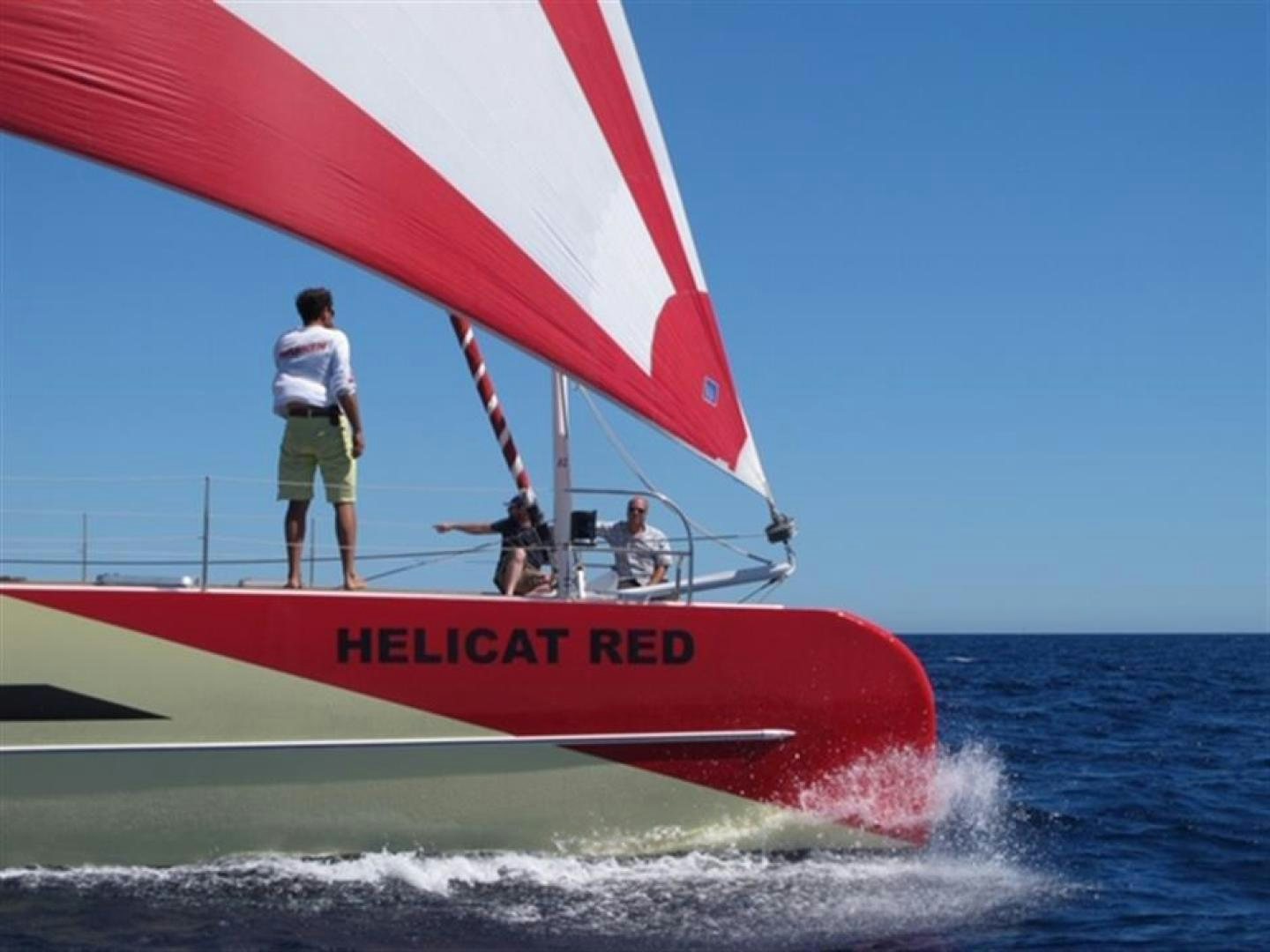 a boat with people on it aboard HELICAT RED Yacht for Sale