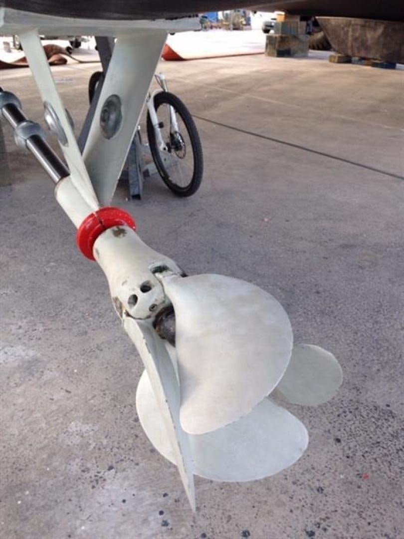 a white robot with a red and black handle aboard HELICAT RED Yacht for Sale