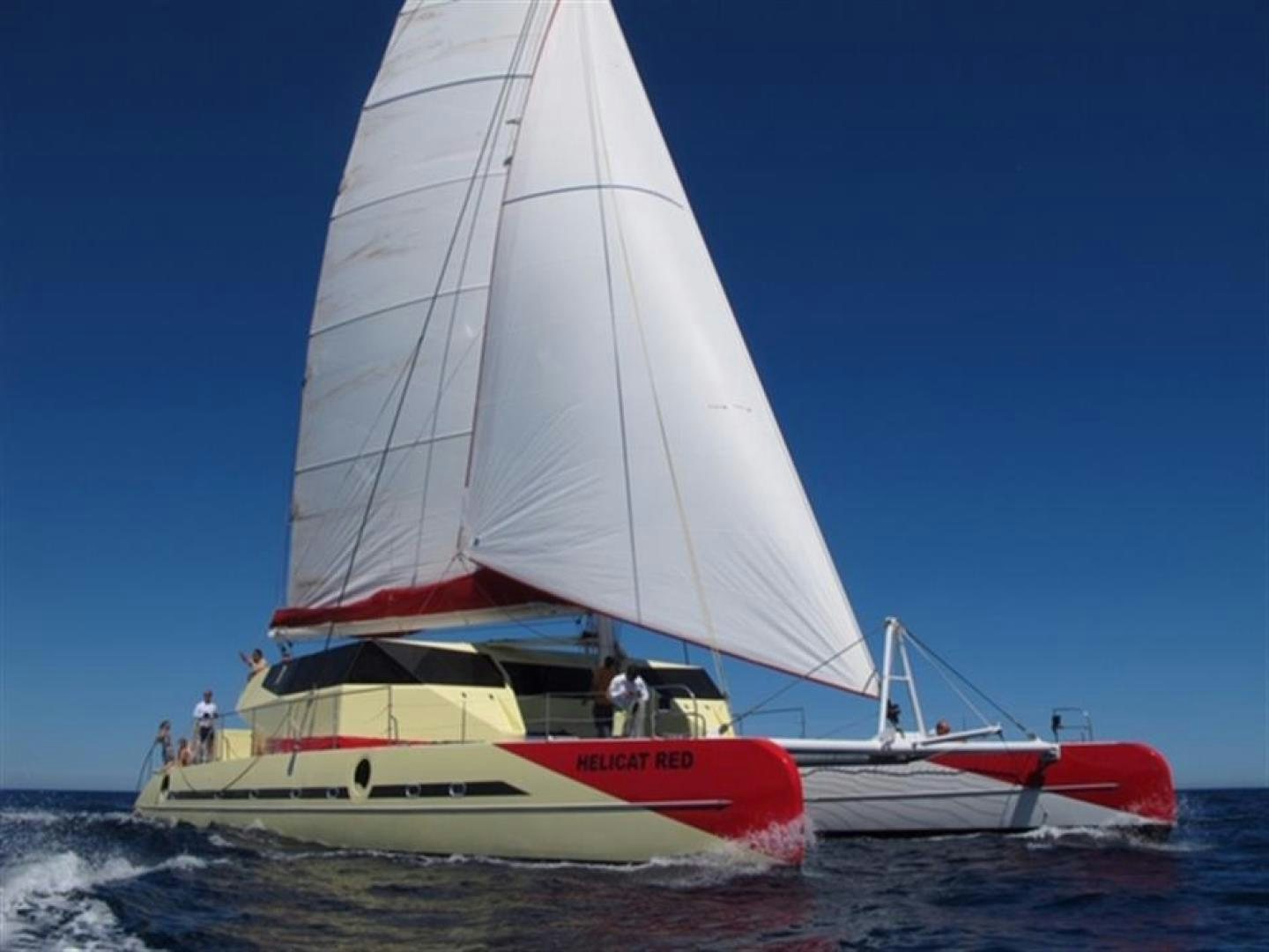 a sailboat on the water aboard HELICAT RED Yacht for Sale