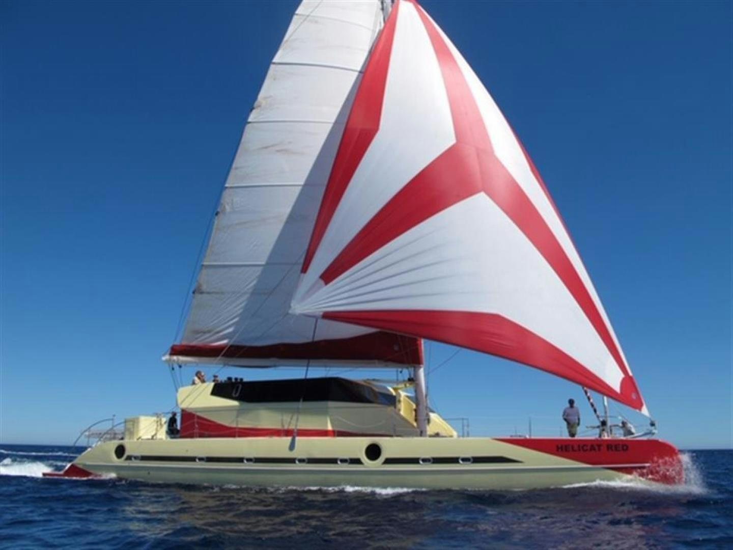 a sailboat on the water aboard HELICAT RED Yacht for Sale