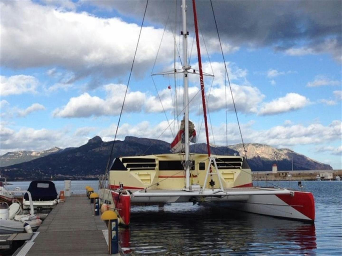 a boat docked at a pier aboard HELICAT RED Yacht for Sale
