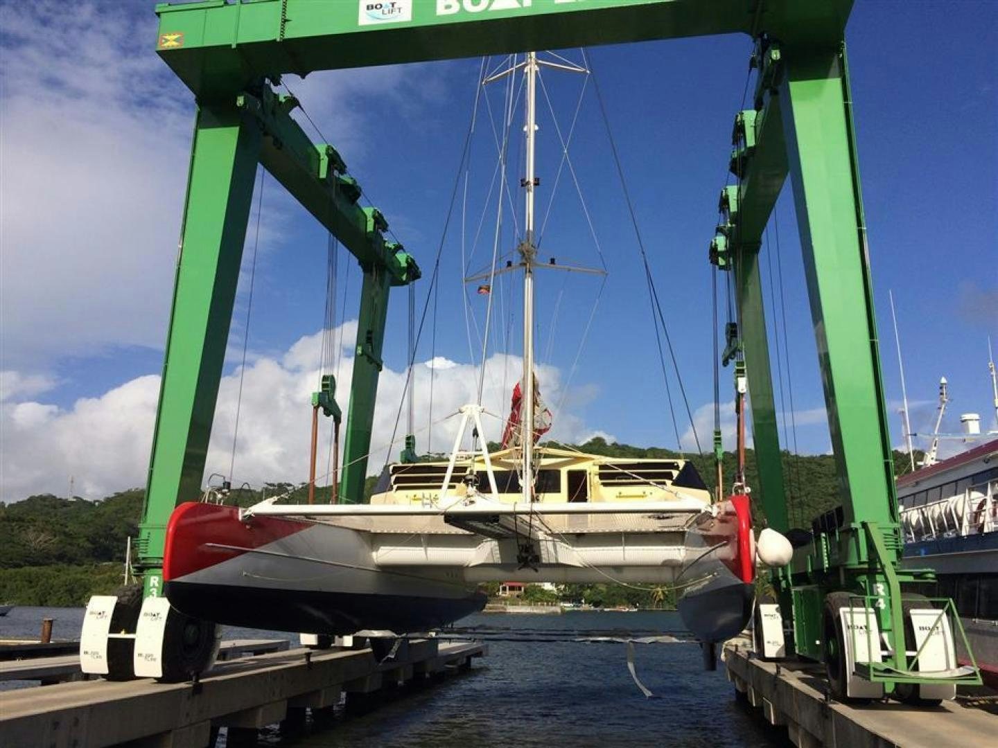 a boat docked at a pier aboard HELICAT RED Yacht for Sale