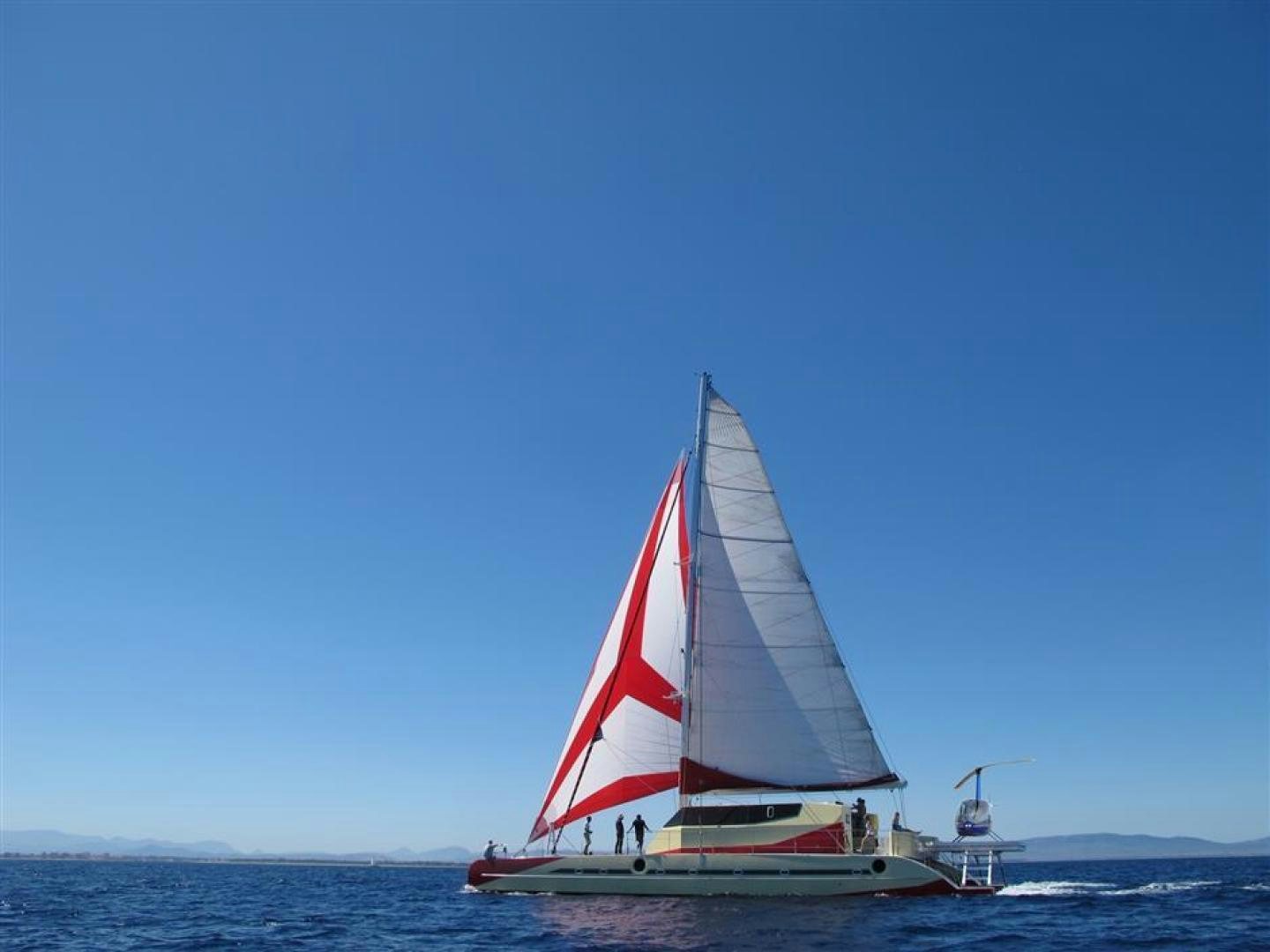 a sailboat on the water aboard HELICAT RED Yacht for Sale