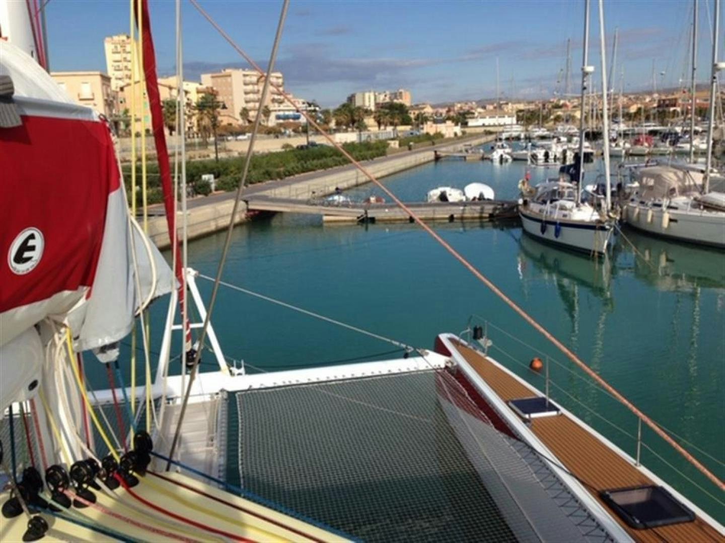 a group of boats are parked in a harbor aboard HELICAT RED Yacht for Sale