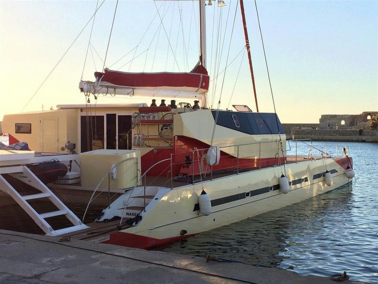 a boat docked at a pier aboard HELICAT RED Yacht for Sale