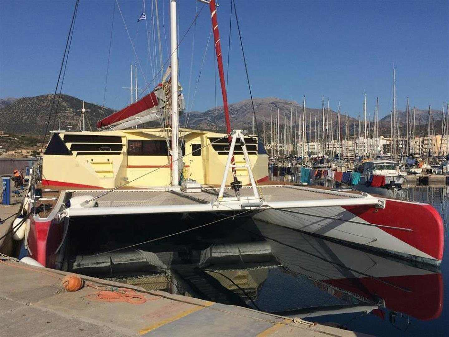 a boat docked at a pier aboard HELICAT RED Yacht for Sale