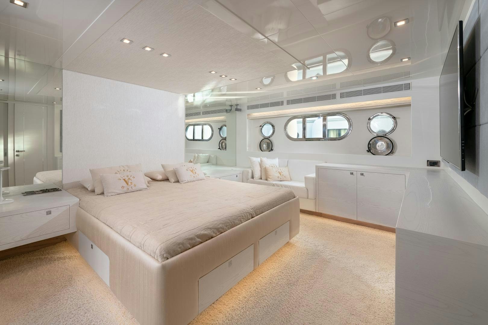 a large bedroom with a bed aboard VIRGIN GOLD Yacht for Sale