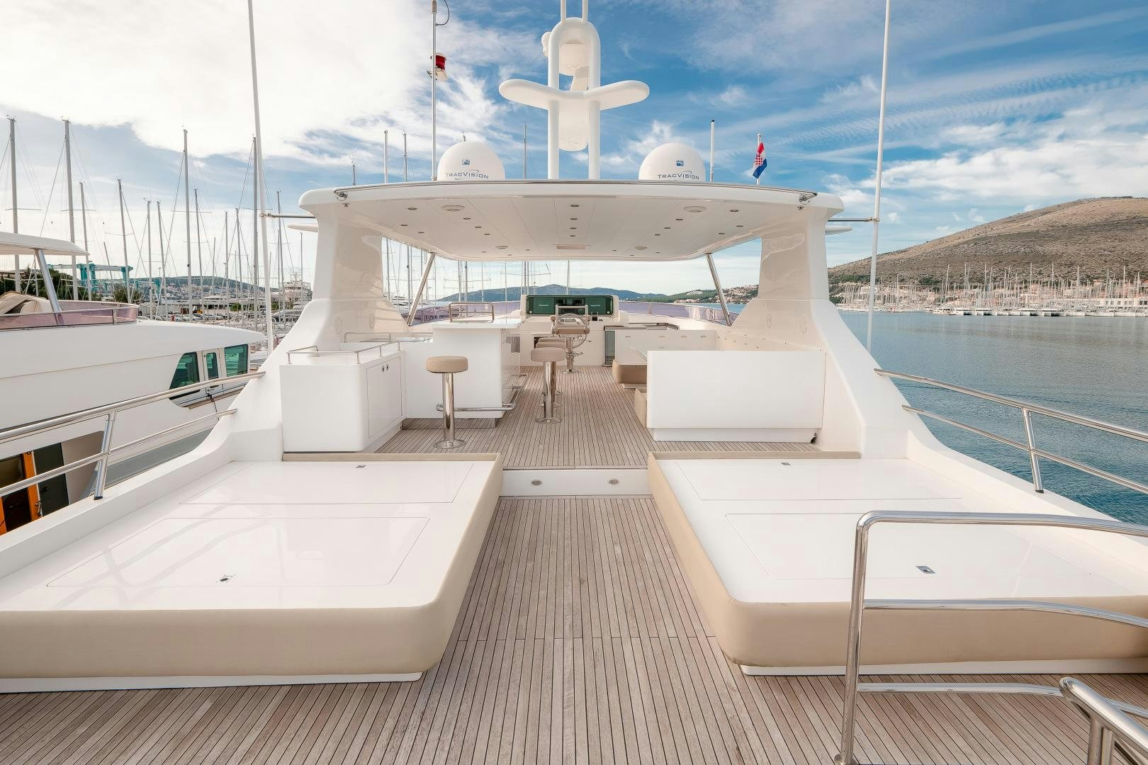a deck with a deck and a boat on it aboard VIRGIN GOLD Yacht for Sale