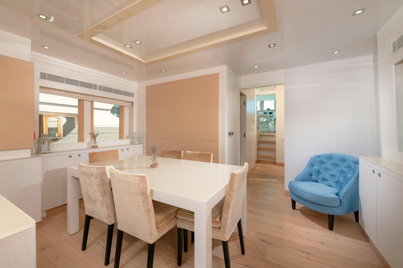 a kitchen with a table and chairs aboard VIRGIN GOLD Yacht for Sale