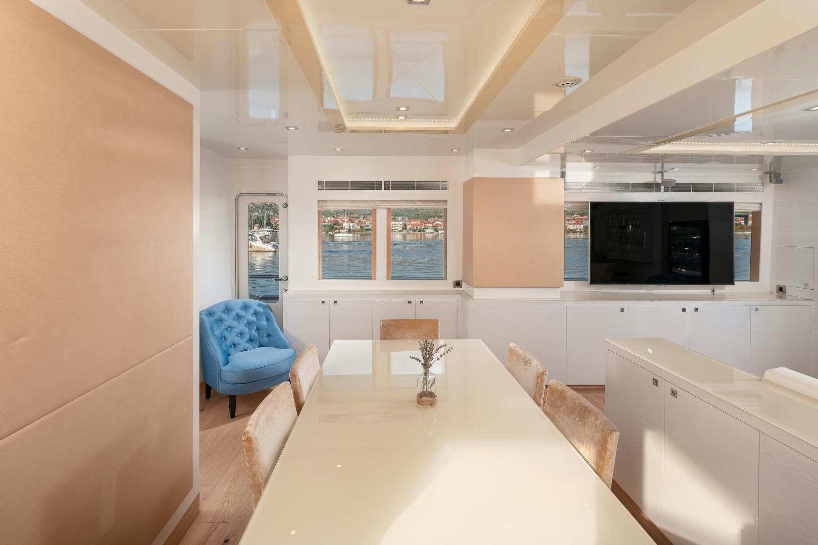 a kitchen with a table and chairs aboard VIRGIN GOLD Yacht for Sale