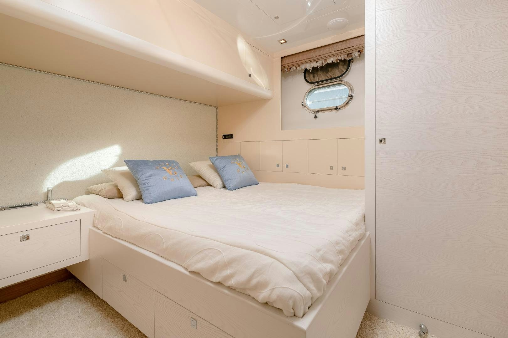 a bed with white sheets aboard VIRGIN GOLD Yacht for Sale