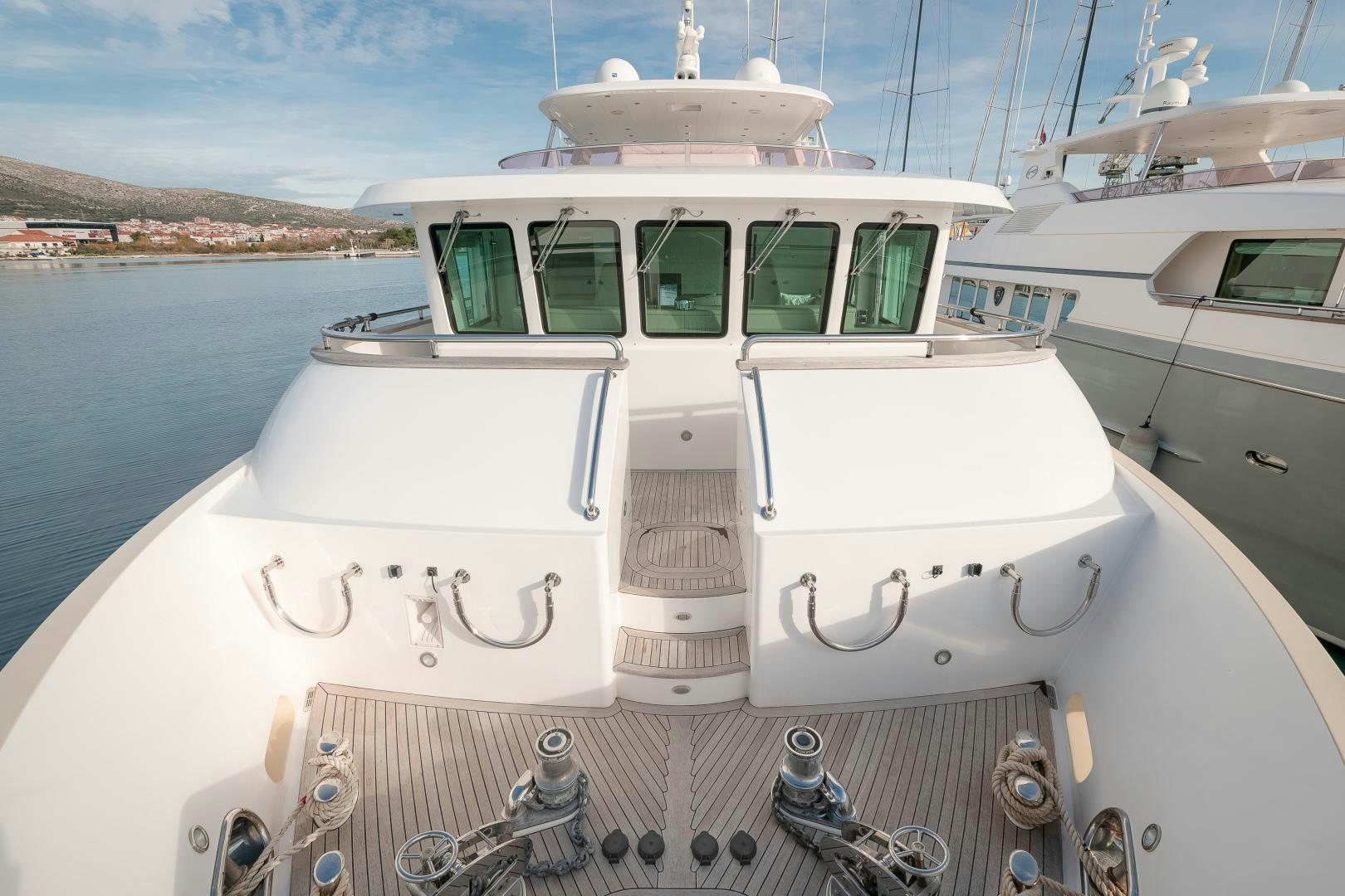 a couple of white boats on a dock aboard VIRGIN GOLD Yacht for Sale