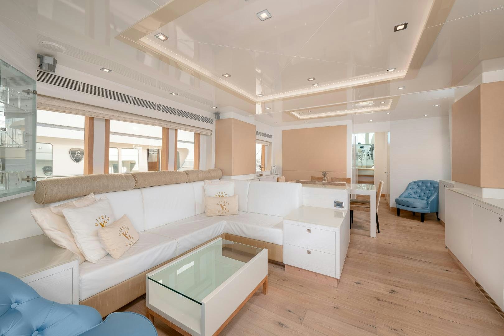 a living room with a couch and a table aboard VIRGIN GOLD Yacht for Sale