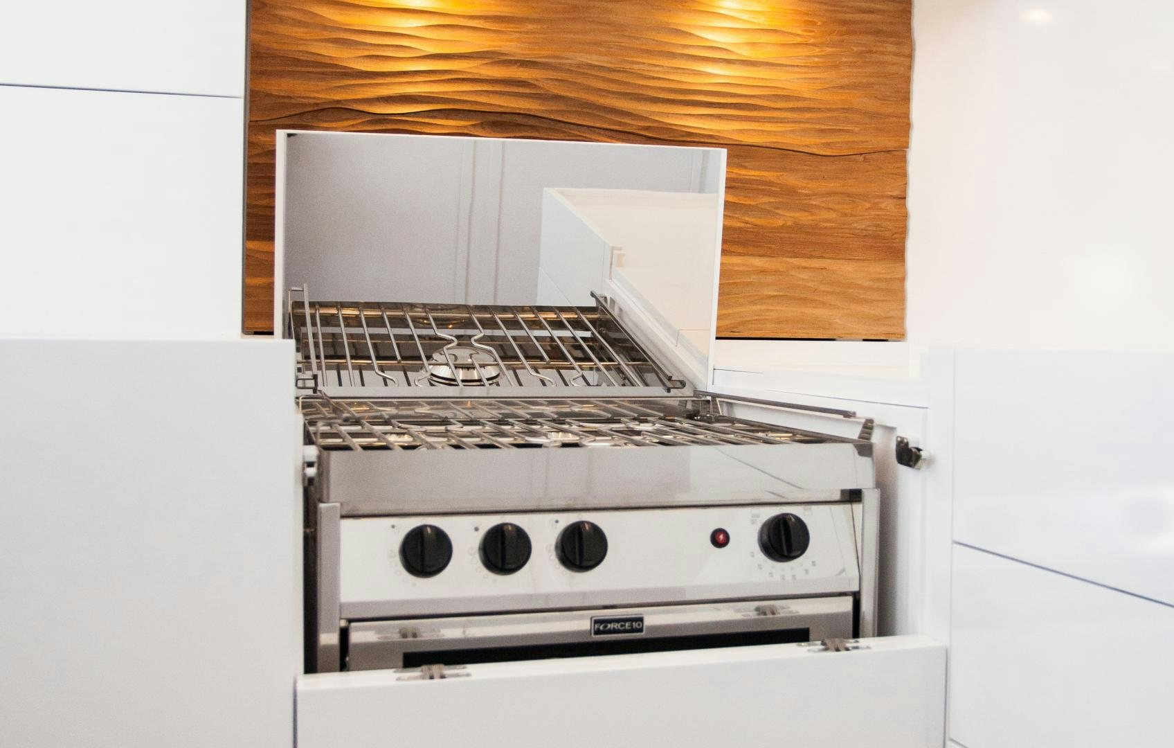 a white stove with a vent aboard AANDEEL Yacht for Sale