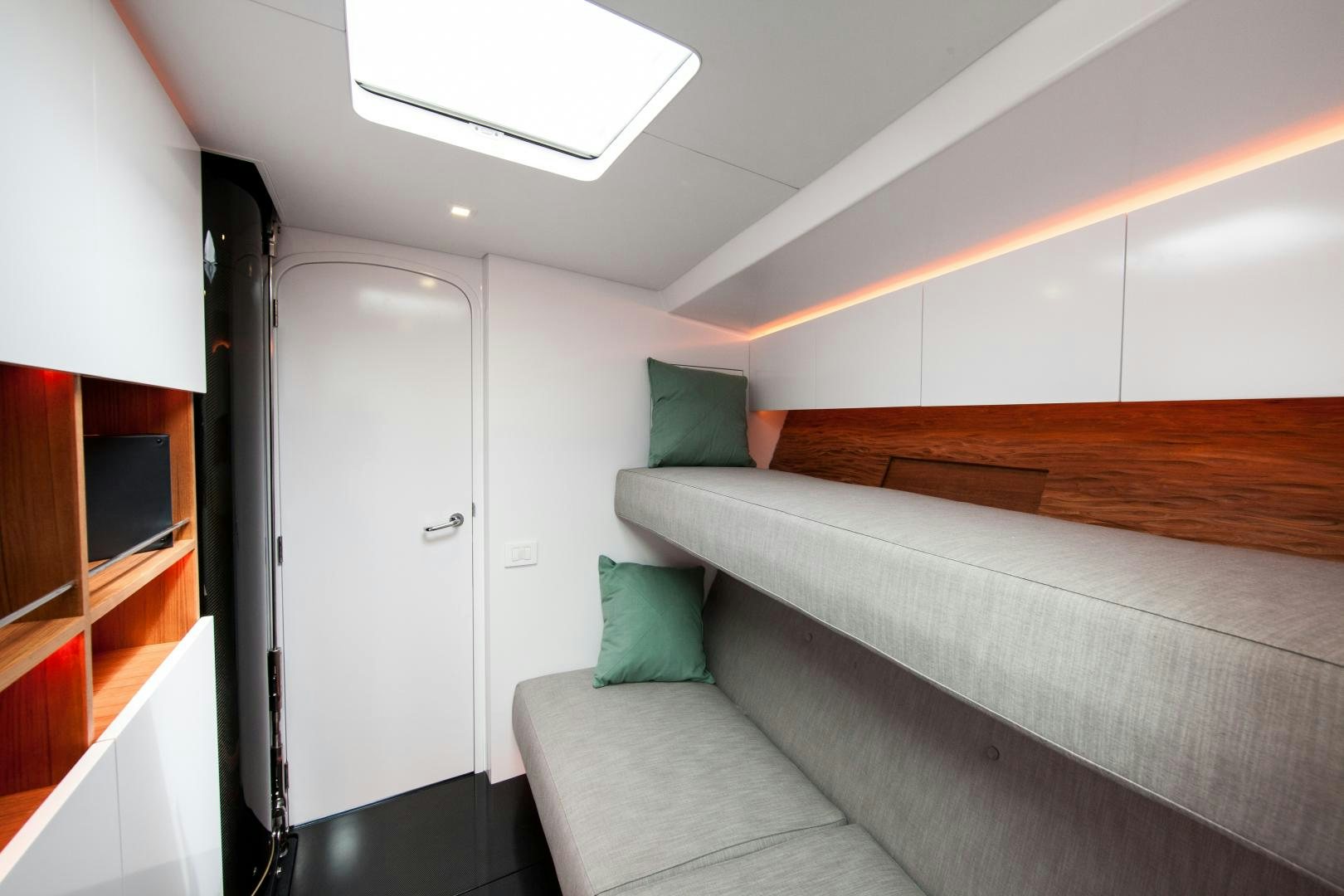 a room with a couch and a television aboard AANDEEL Yacht for Sale