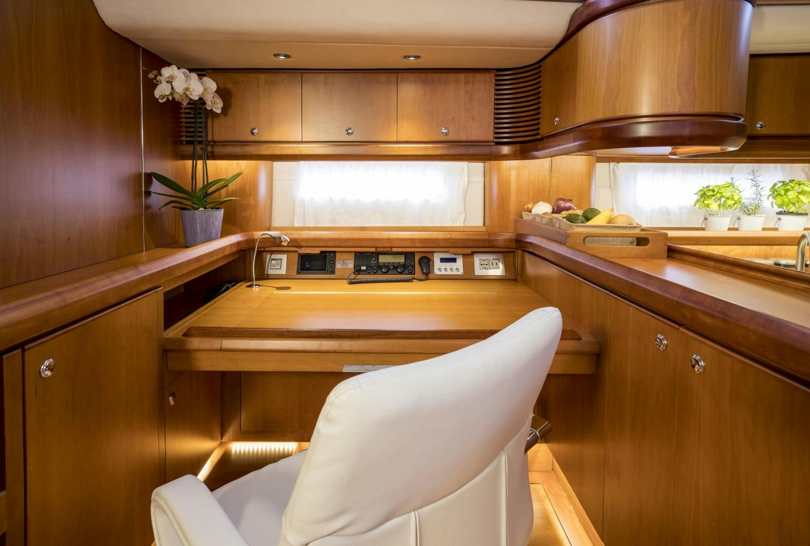 a kitchen with wooden cabinets aboard aglaia Yacht for Sale