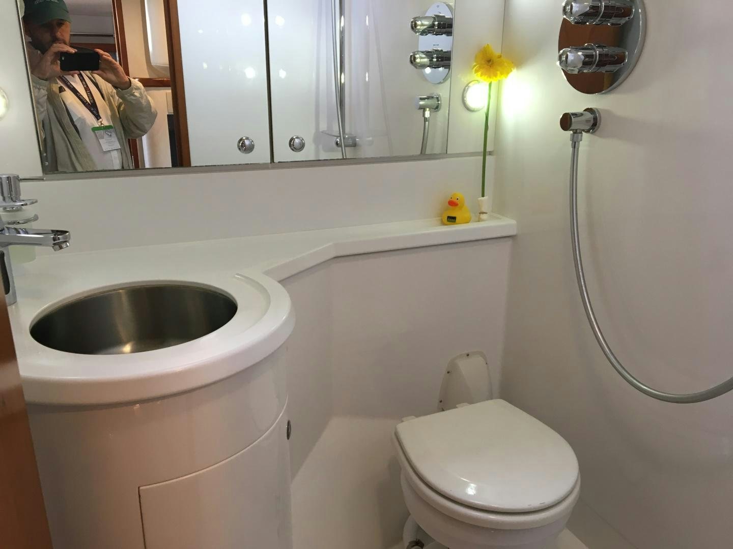a bathroom with a sink and toilet aboard aglaia Yacht for Sale