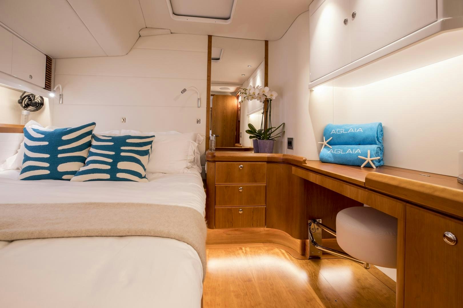 a room with a bed and a desk aboard aglaia Yacht for Sale