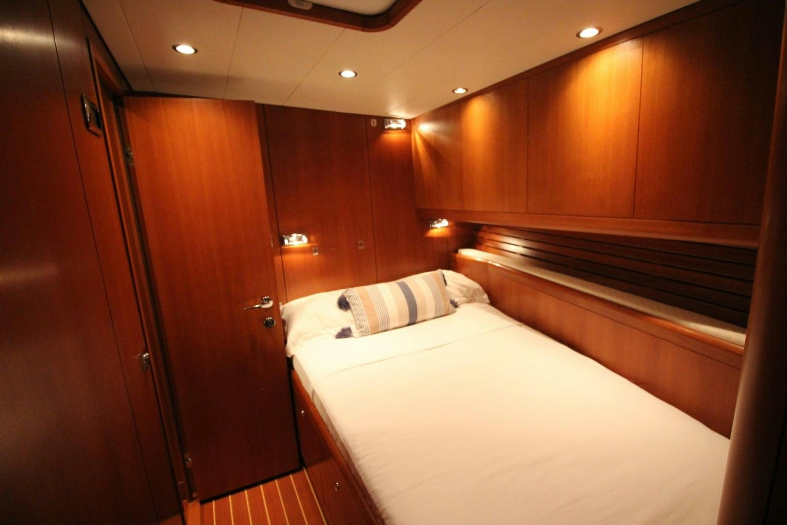 a room with wooden cabinets aboard kiamar Yacht for Sale