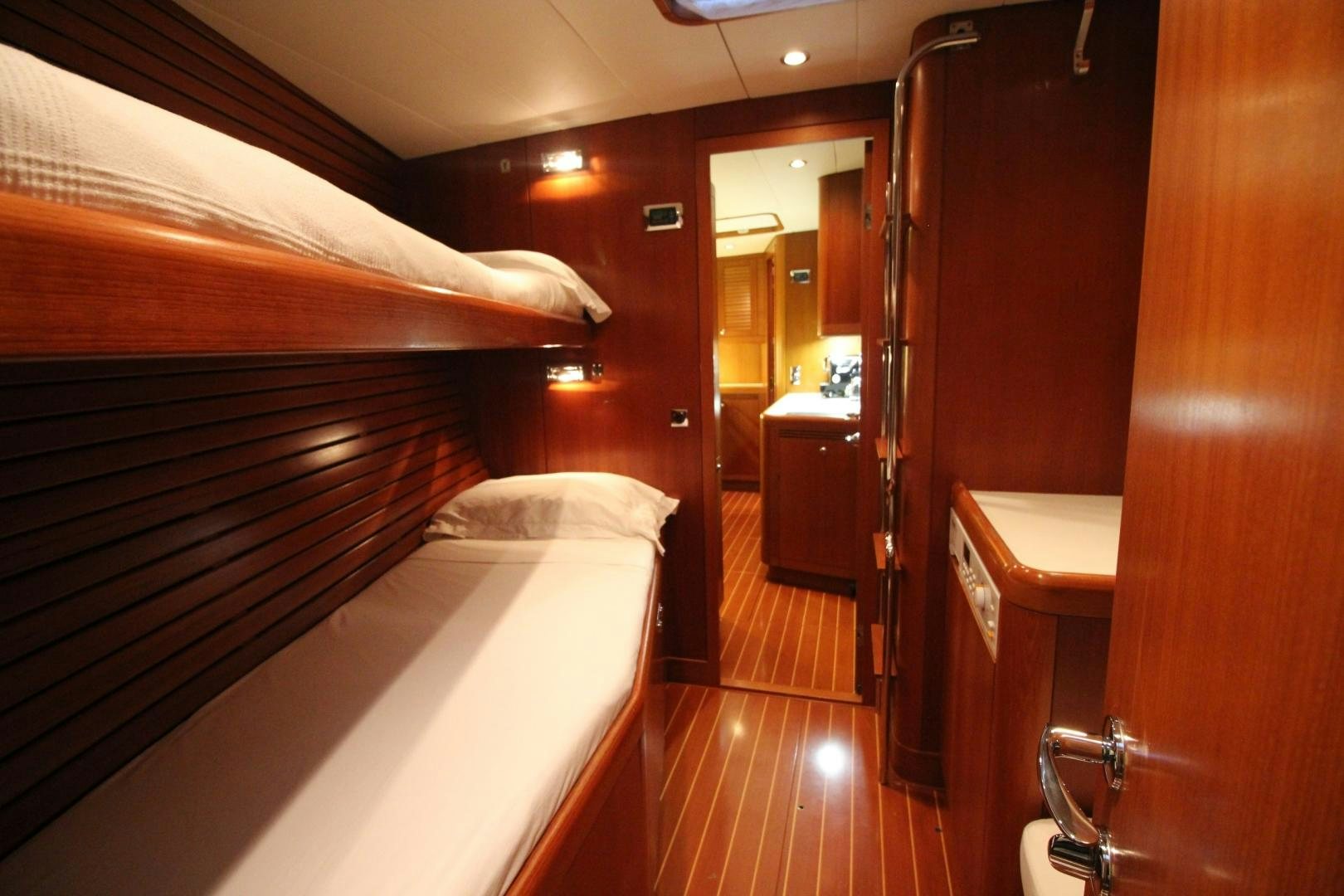 a room with a bed and a mirror aboard kiamar Yacht for Sale