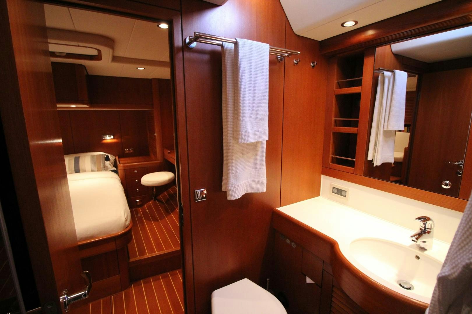 a bathroom with a sink and a mirror aboard kiamar Yacht for Sale