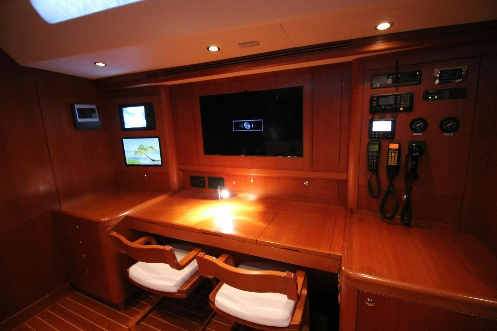 a room with a table and chairs aboard kiamar Yacht for Sale