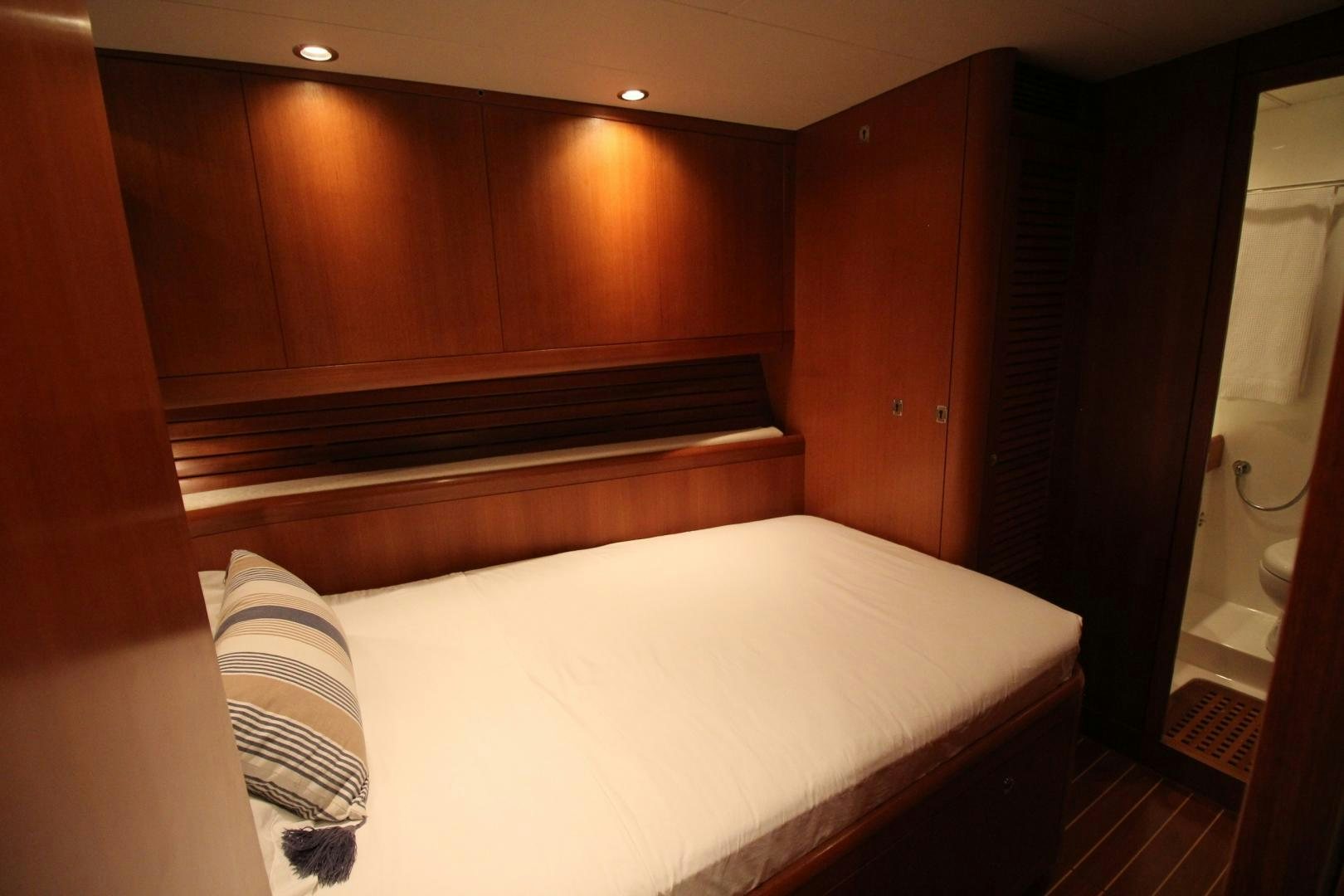 a bed with a white sheet aboard kiamar Yacht for Sale