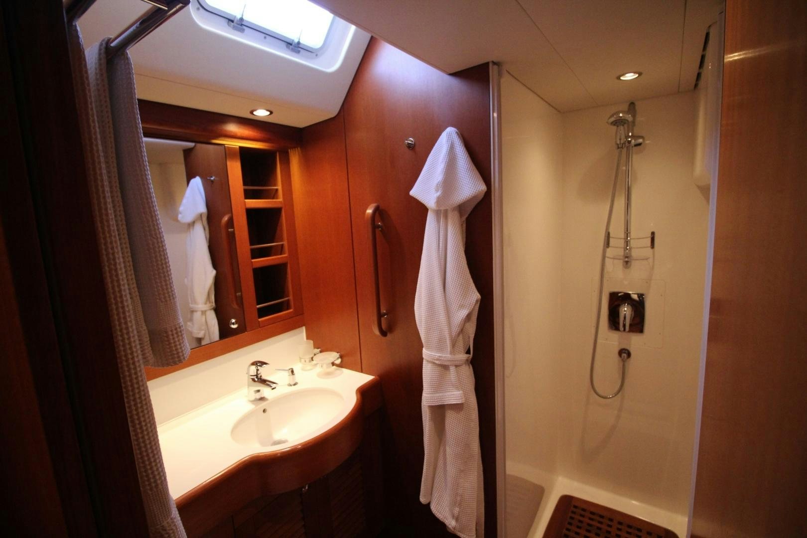 a bathroom with a sink and a mirror aboard kiamar Yacht for Sale