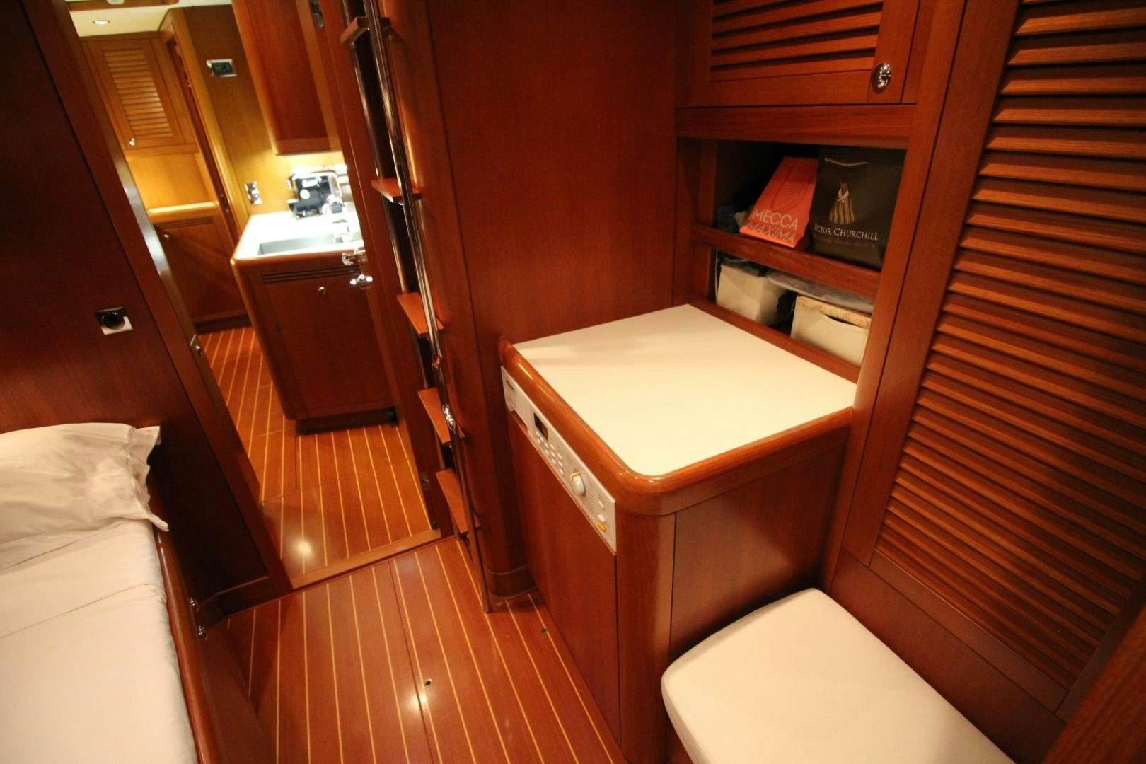 a room with a bed and a desk aboard kiamar Yacht for Sale