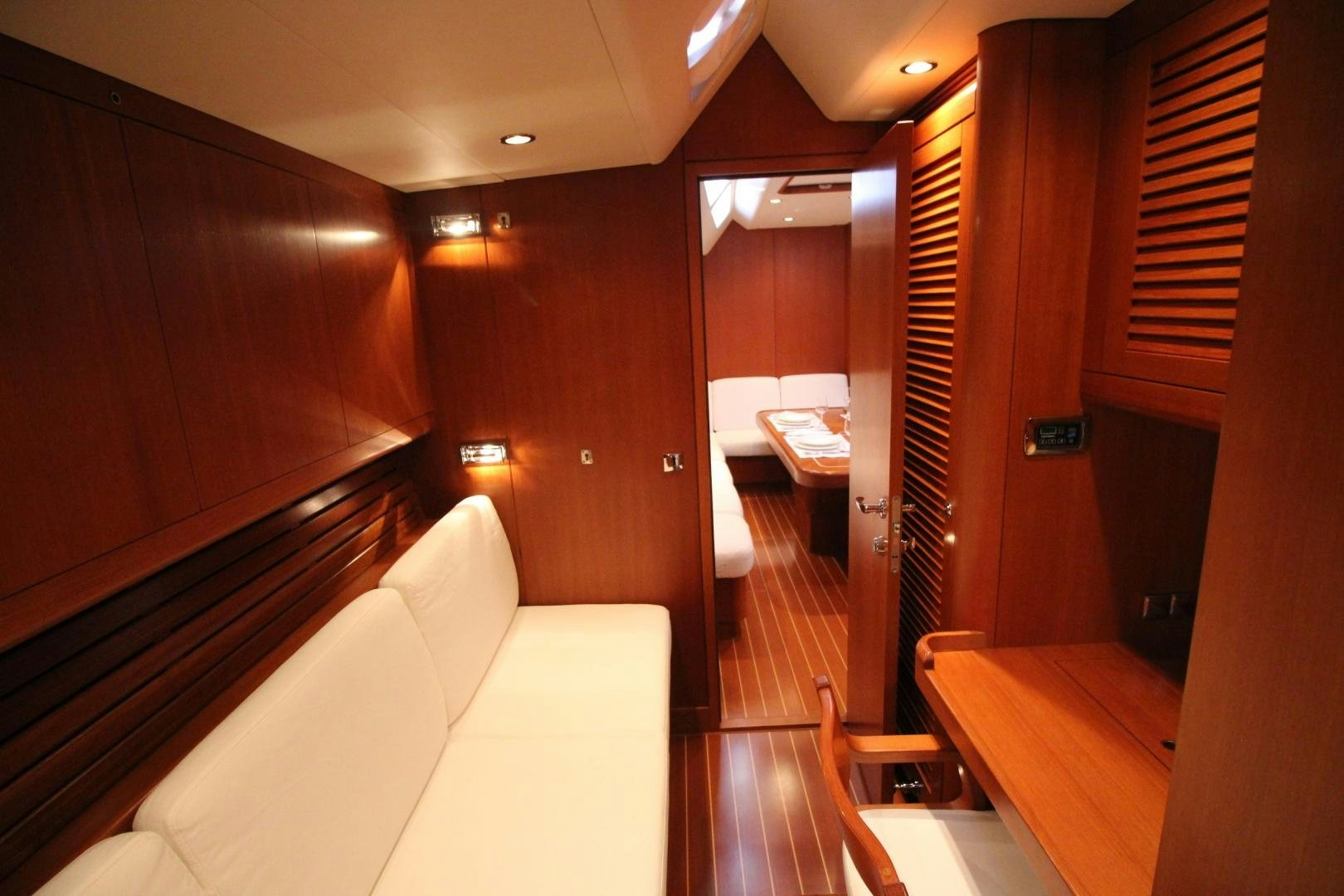 a room with a bed and a couch aboard kiamar Yacht for Sale