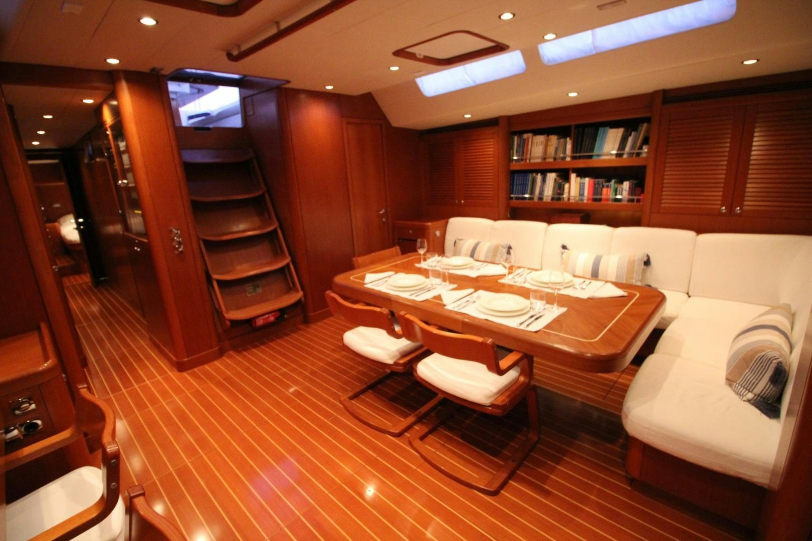 a room with a table and chairs aboard kiamar Yacht for Sale