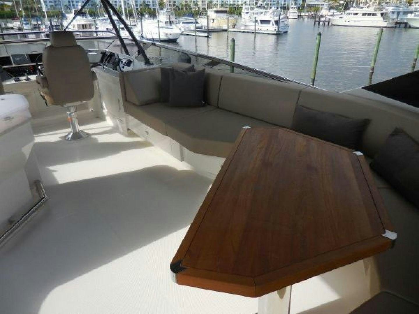 a table with chairs on it aboard No Name Yacht for Sale