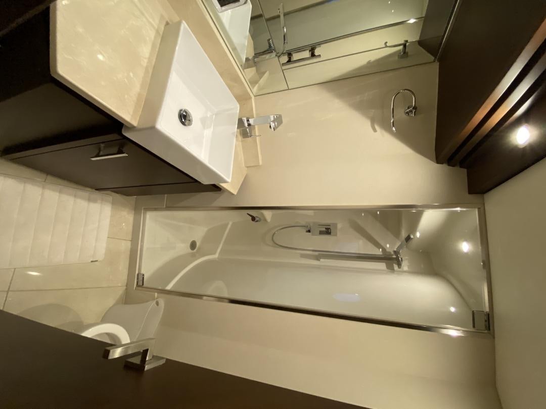 a bathroom with a sink and cabinets aboard No Name Yacht for Sale