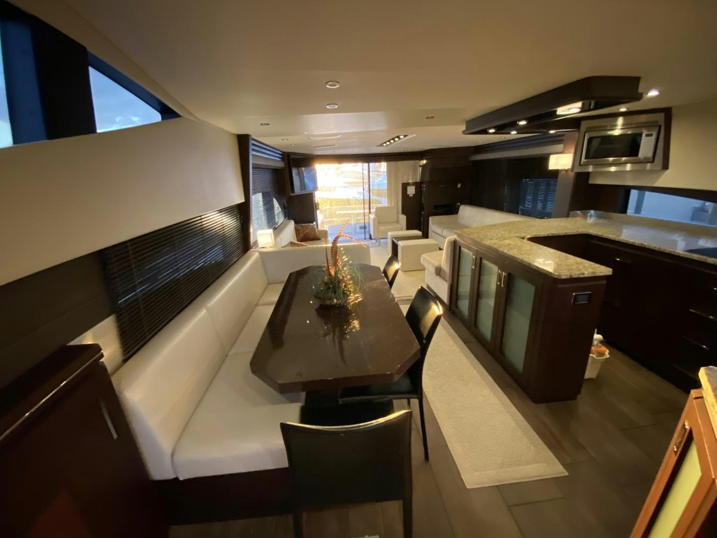 a room with a table and chairs aboard No Name Yacht for Sale