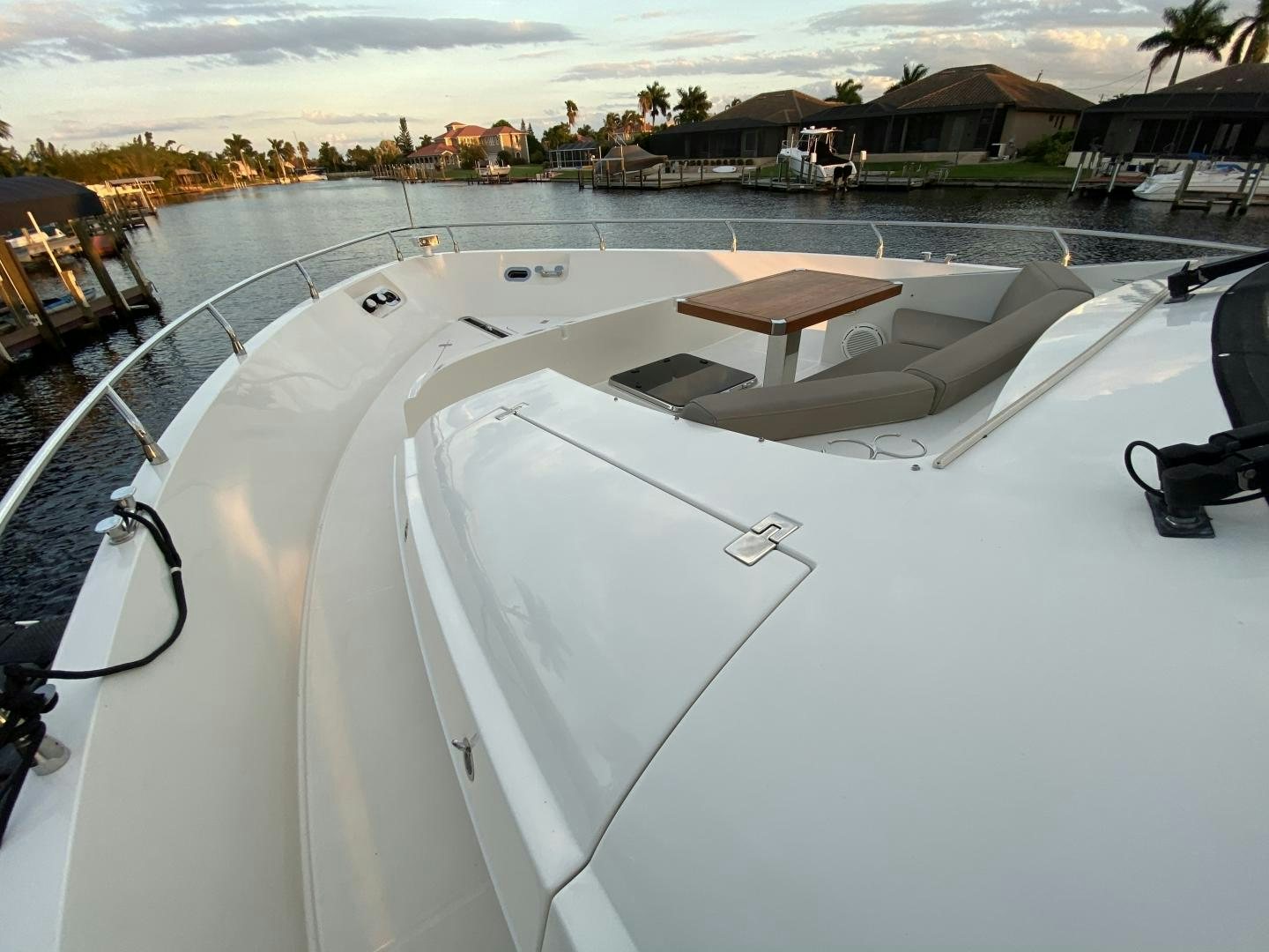 a white boat on a deck aboard No Name Yacht for Sale