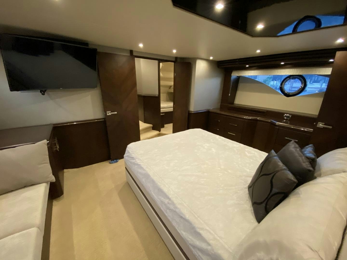 a room with a bed and a mirror aboard No Name Yacht for Sale