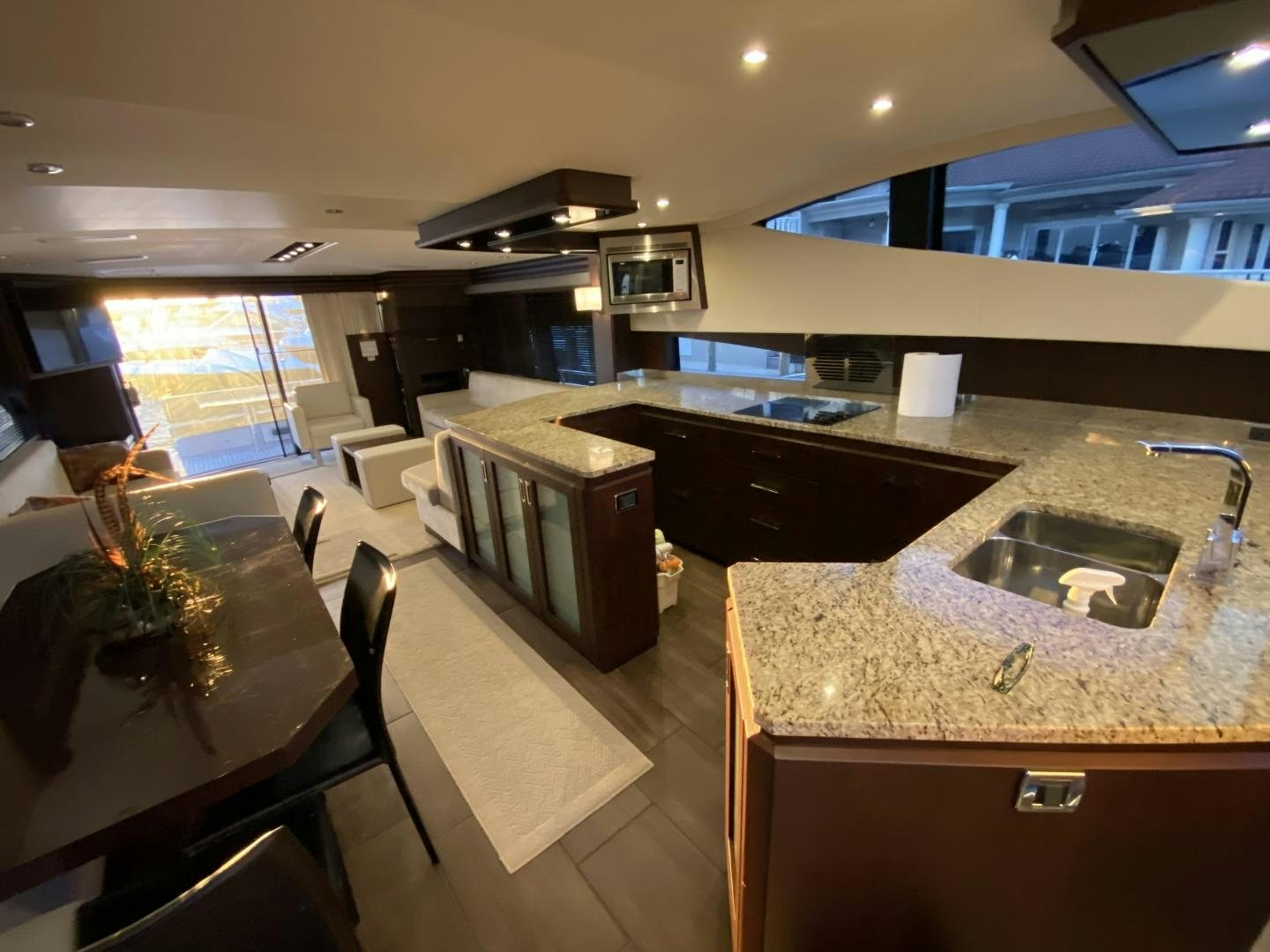 a kitchen with a marble counter top aboard No Name Yacht for Sale