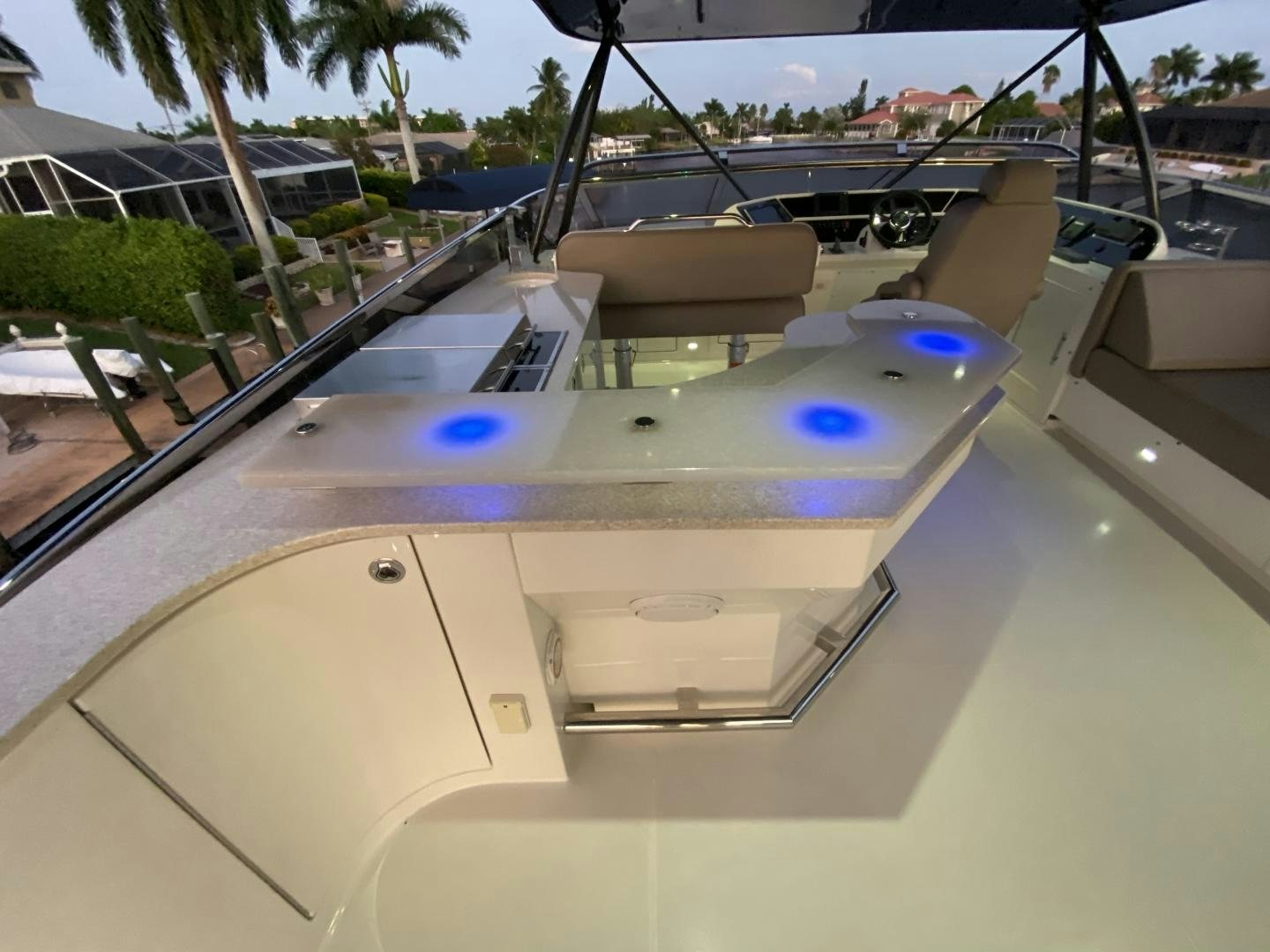 a large white boat on a deck aboard No Name Yacht for Sale