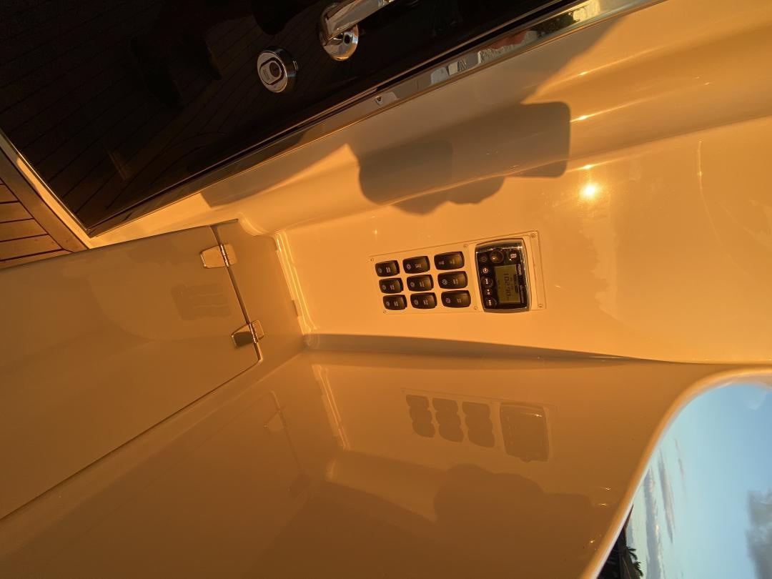 a white car with a black dial aboard No Name Yacht for Sale