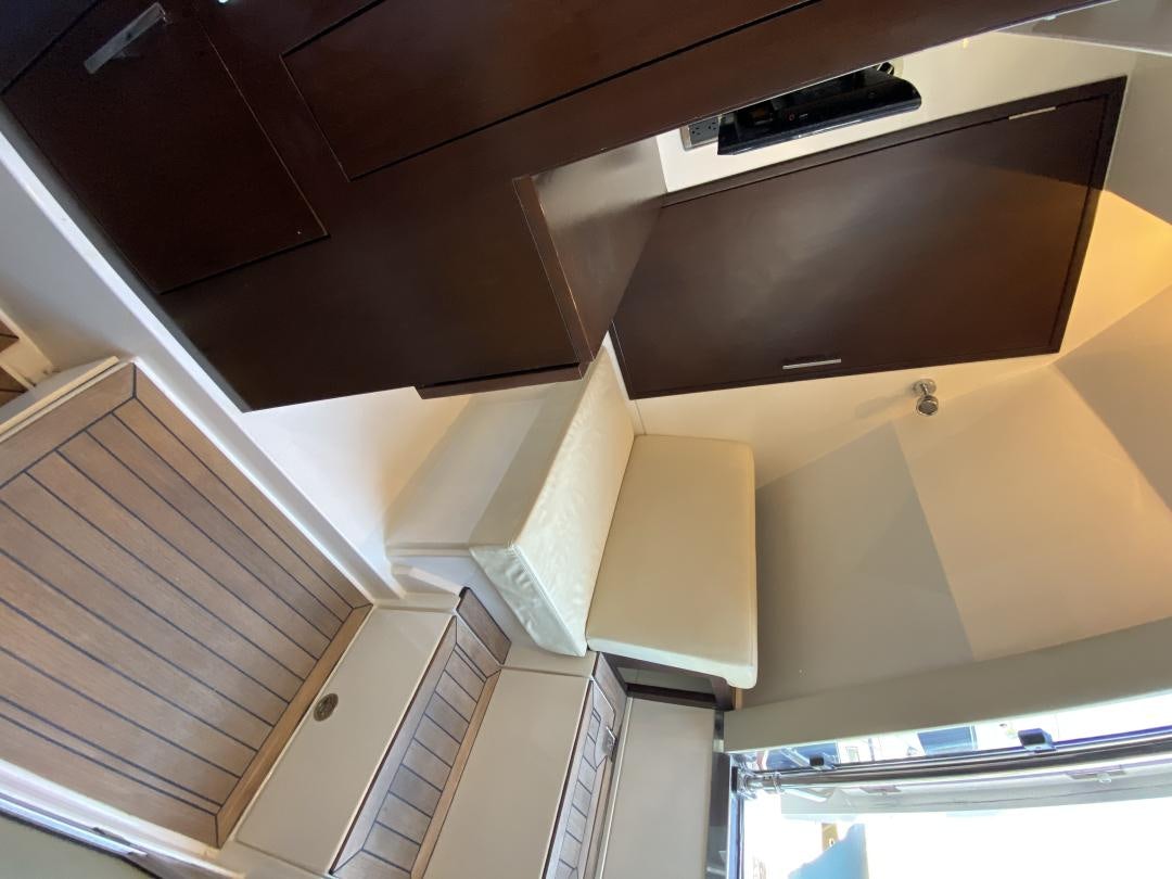 a tv mounted on the ceiling aboard No Name Yacht for Sale
