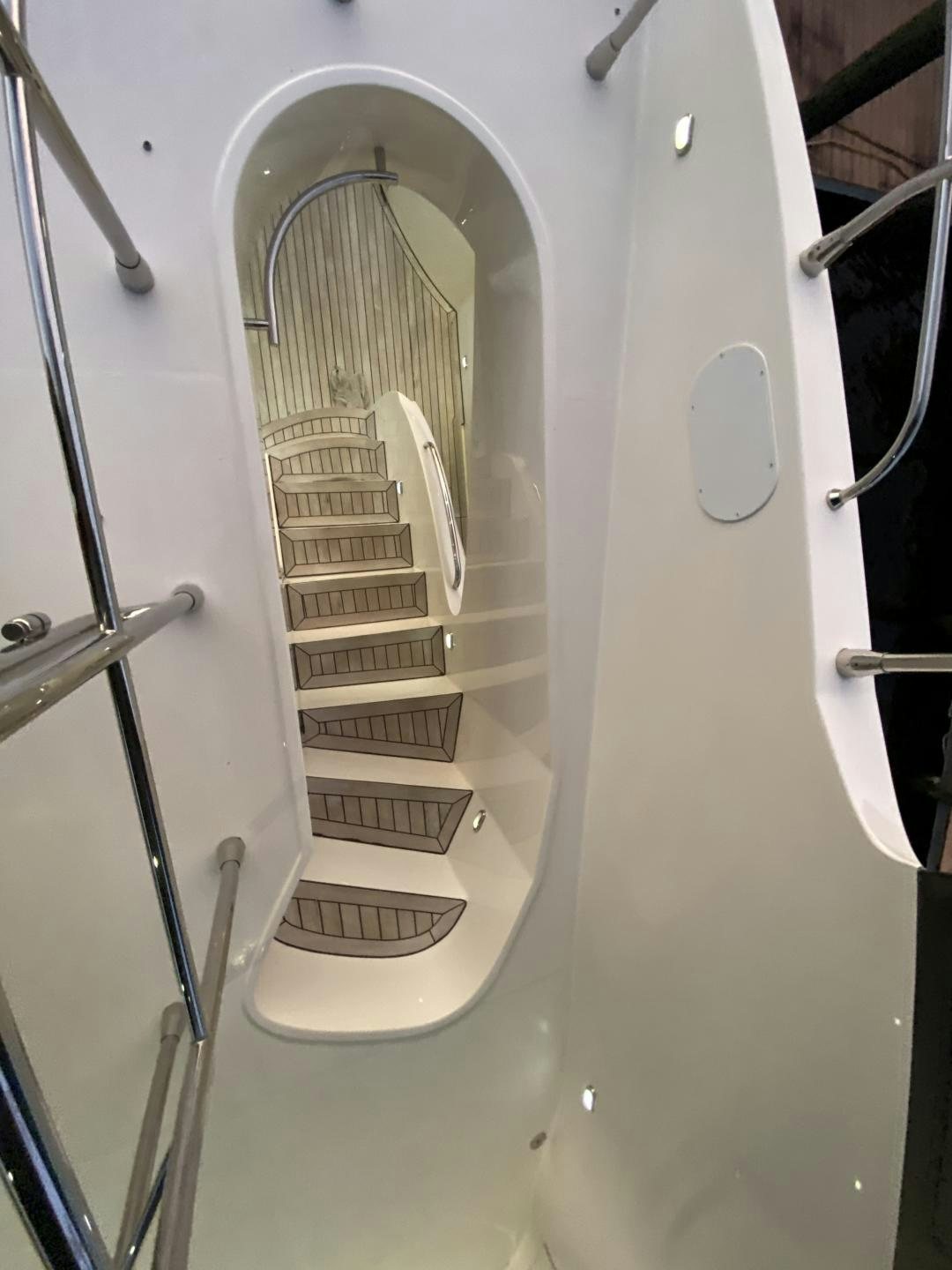 a white metal staircase aboard No Name Yacht for Sale