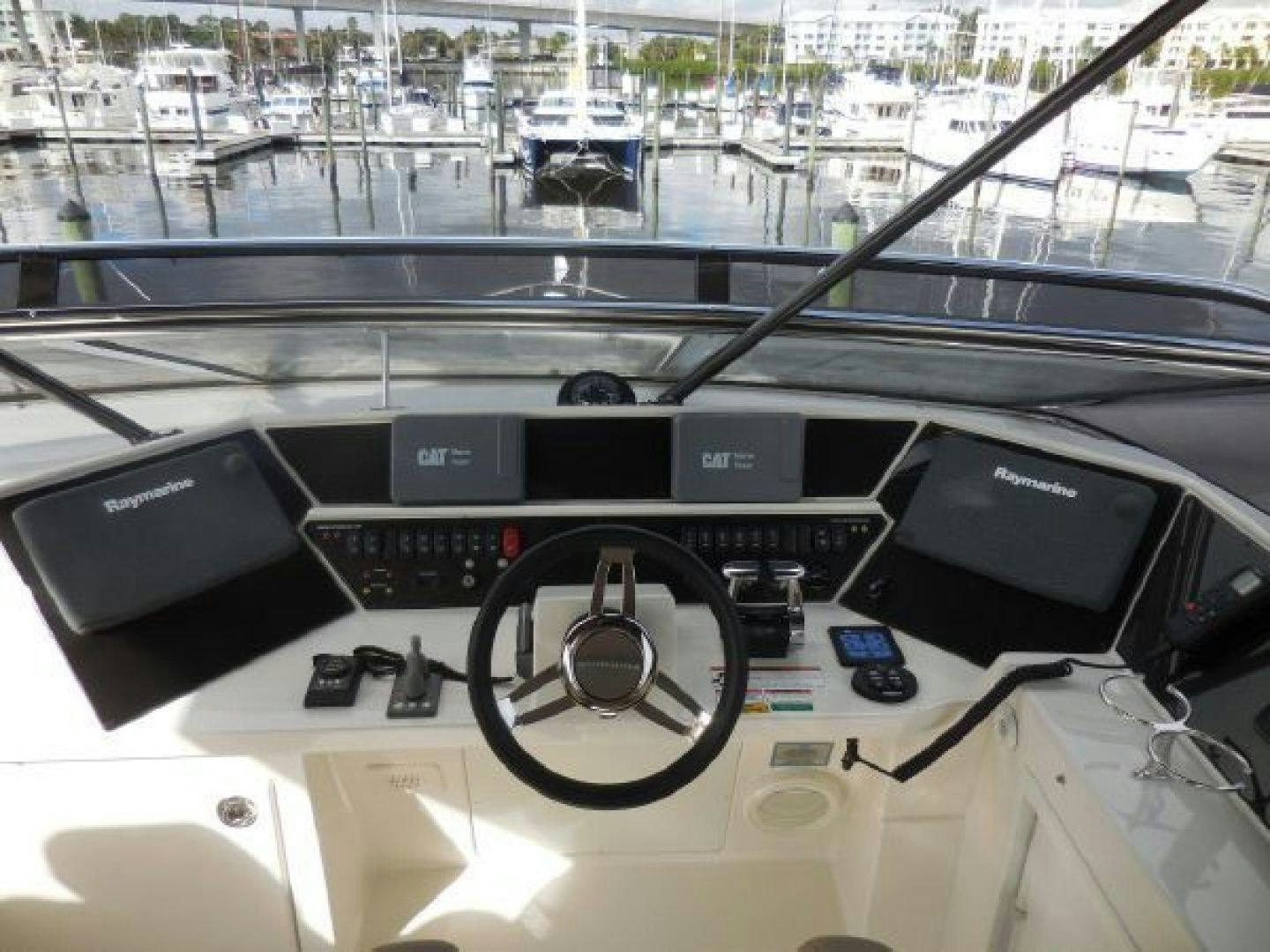 a black console with a black console and a white table with a black table and chairs and a aboard No Name Yacht for Sale