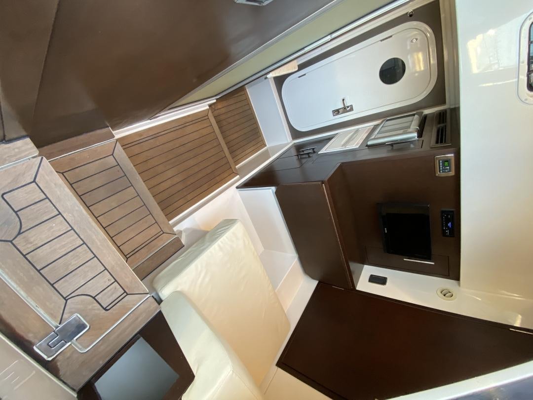 a room with a microwave and a shelf aboard No Name Yacht for Sale