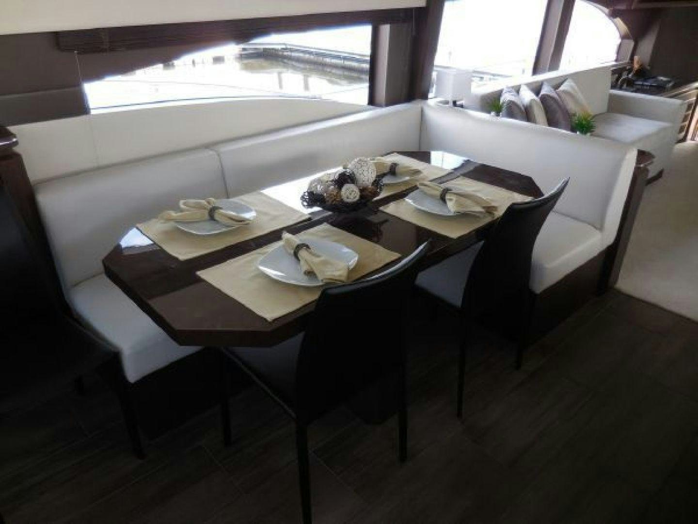 a dining table with plates and a plate of food aboard No Name Yacht for Sale