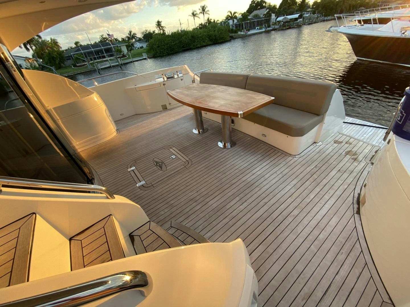 a boat dock with a table and chairs on it aboard No Name Yacht for Sale