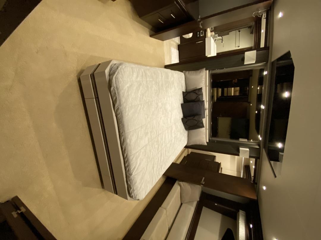 a room with a bed and a desk aboard No Name Yacht for Sale