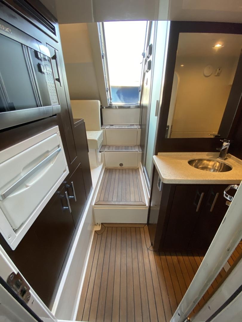 a bathroom with a sink and a mirror aboard No Name Yacht for Sale