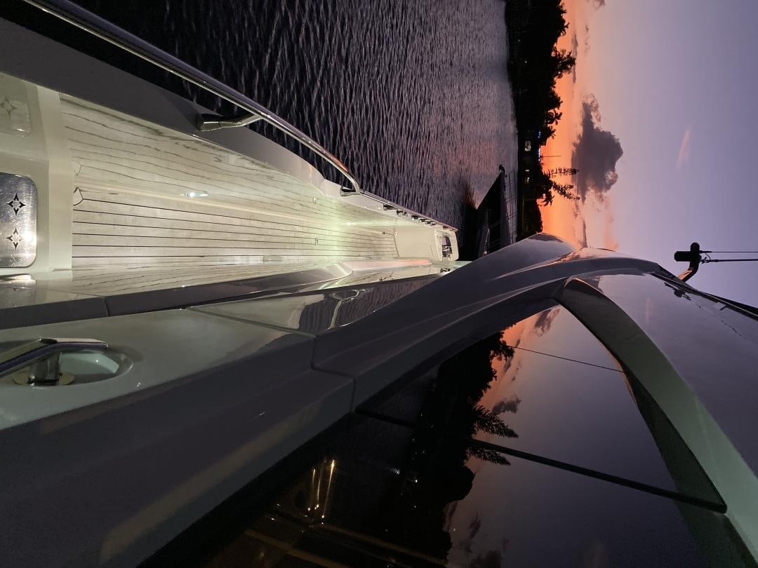 a person standing on a balcony aboard No Name Yacht for Sale
