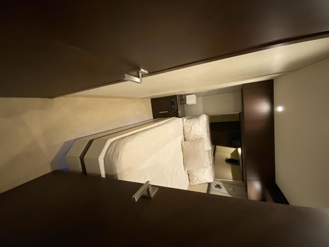 a room with a mirror and a towel from the ceiling aboard No Name Yacht for Sale