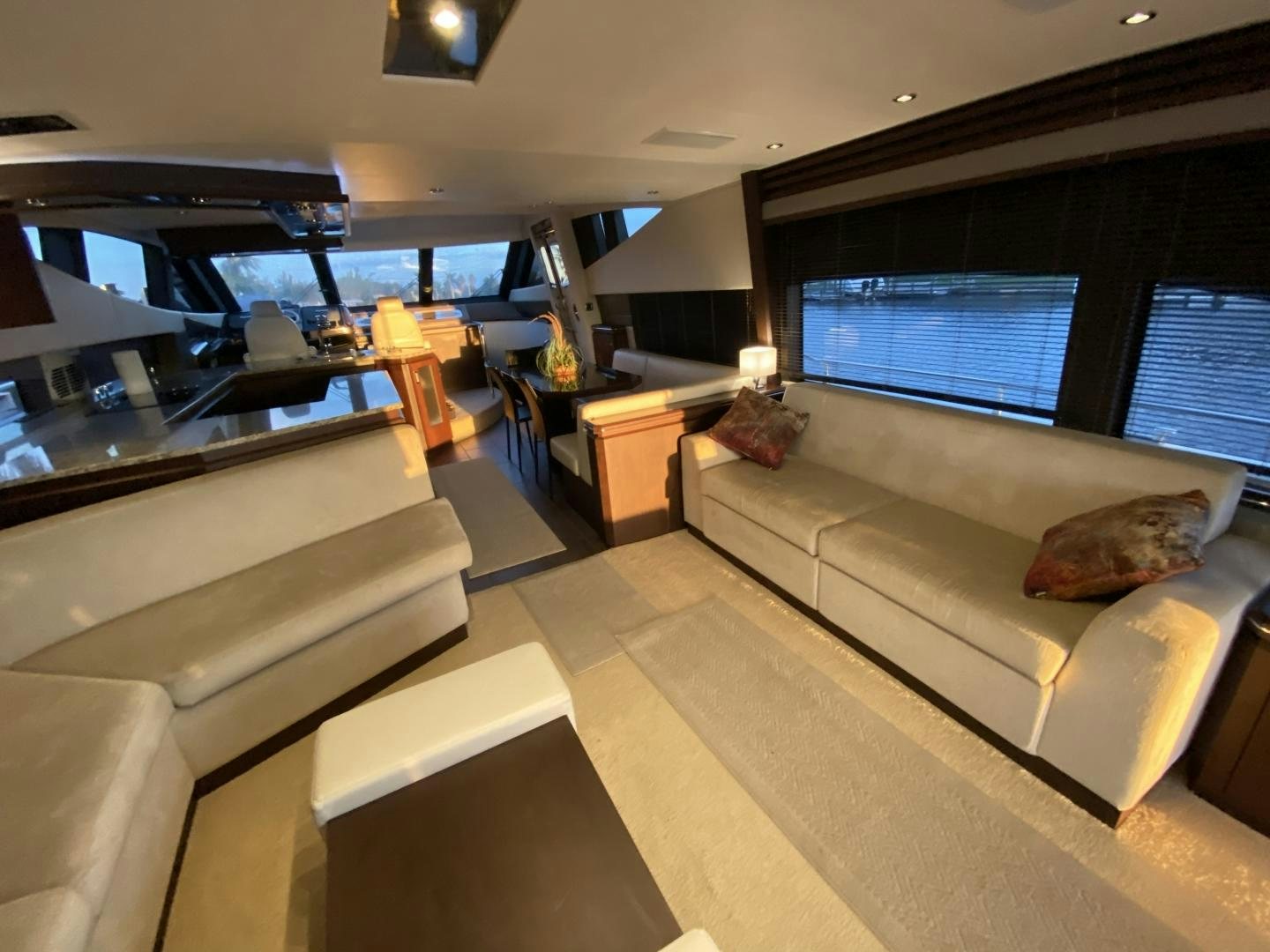 a living room with a couch and a table aboard No Name Yacht for Sale